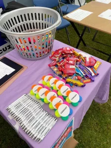Circuit promotional table including pens, sweets and highlighters